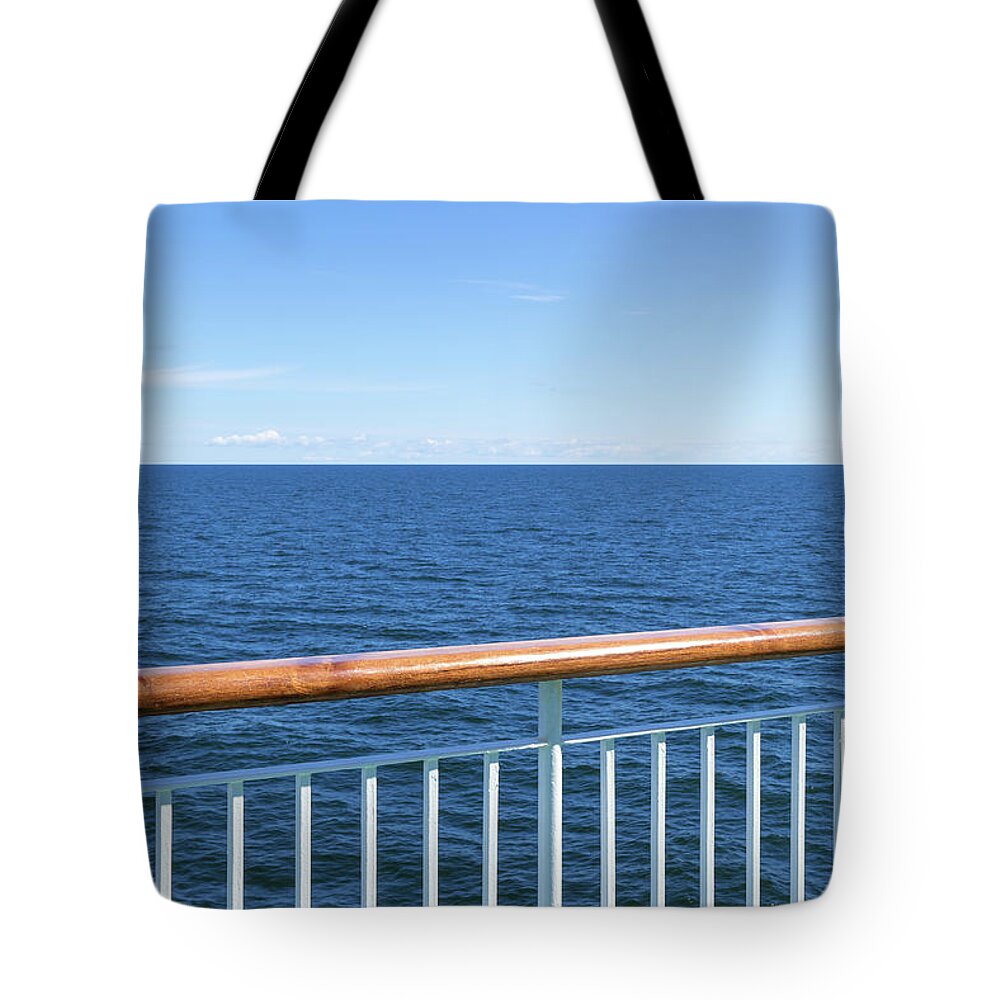 Sea Tote Bag featuring the photograph View at the sea from passenger ship by GoodMood Art