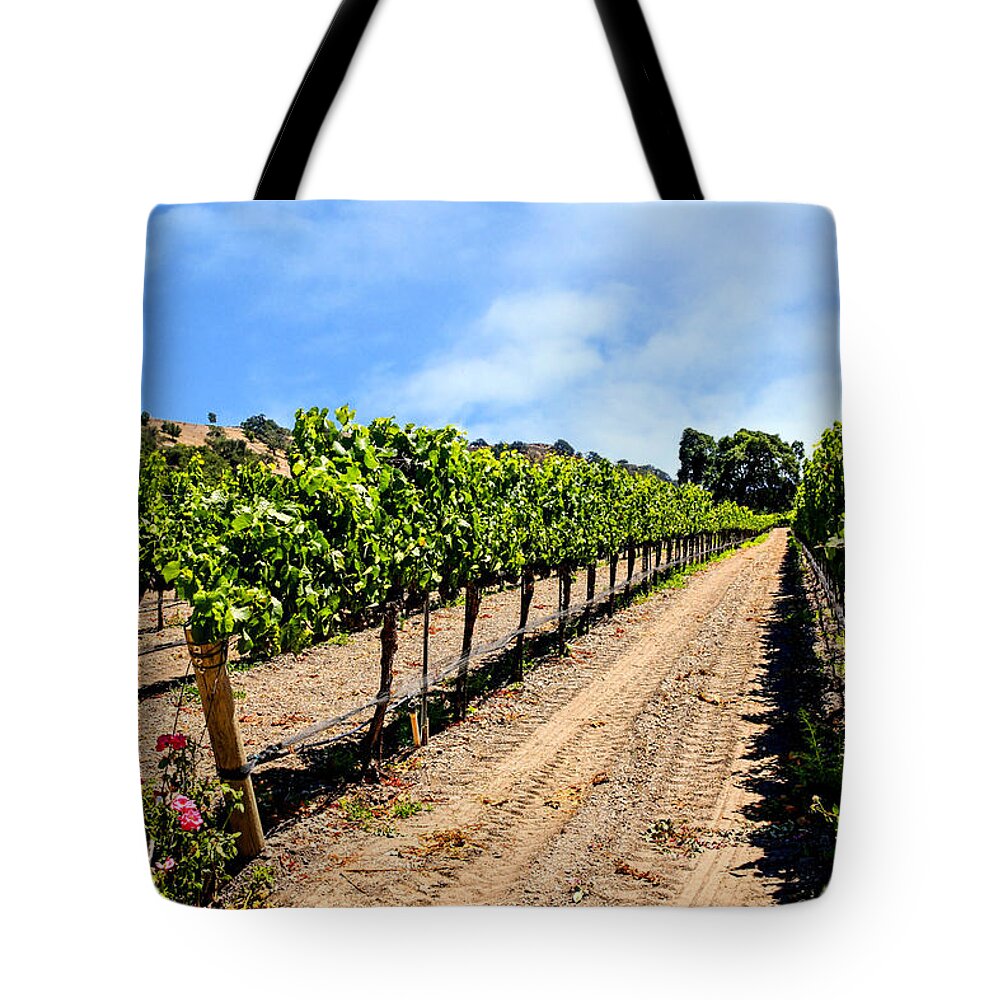 Vineyards; Foxen; Canyon; Ca; Vines; Winery; Golden; Country; Nature; Green; Landscape; Rural; Farm; Growing; Country; Summer; Wine; Agriculture; Grapes; Viticulture; Outdoor; Grape; Vine; Sun; Countryside; Field; Beauty; Plant; Fruit; Grow; Fresh; Scenic; Color; Sunny; Grapevine; Natural; Farming; Vintage; Row; Trees; Santa; Barbara; County; California; American; Usa Tote Bag featuring the photograph Vines and Roses by Chris Smith