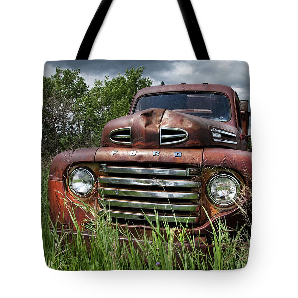 Rusty Trucks Tote Bag featuring the photograph Vintage Ford Truck by Theresa Tahara