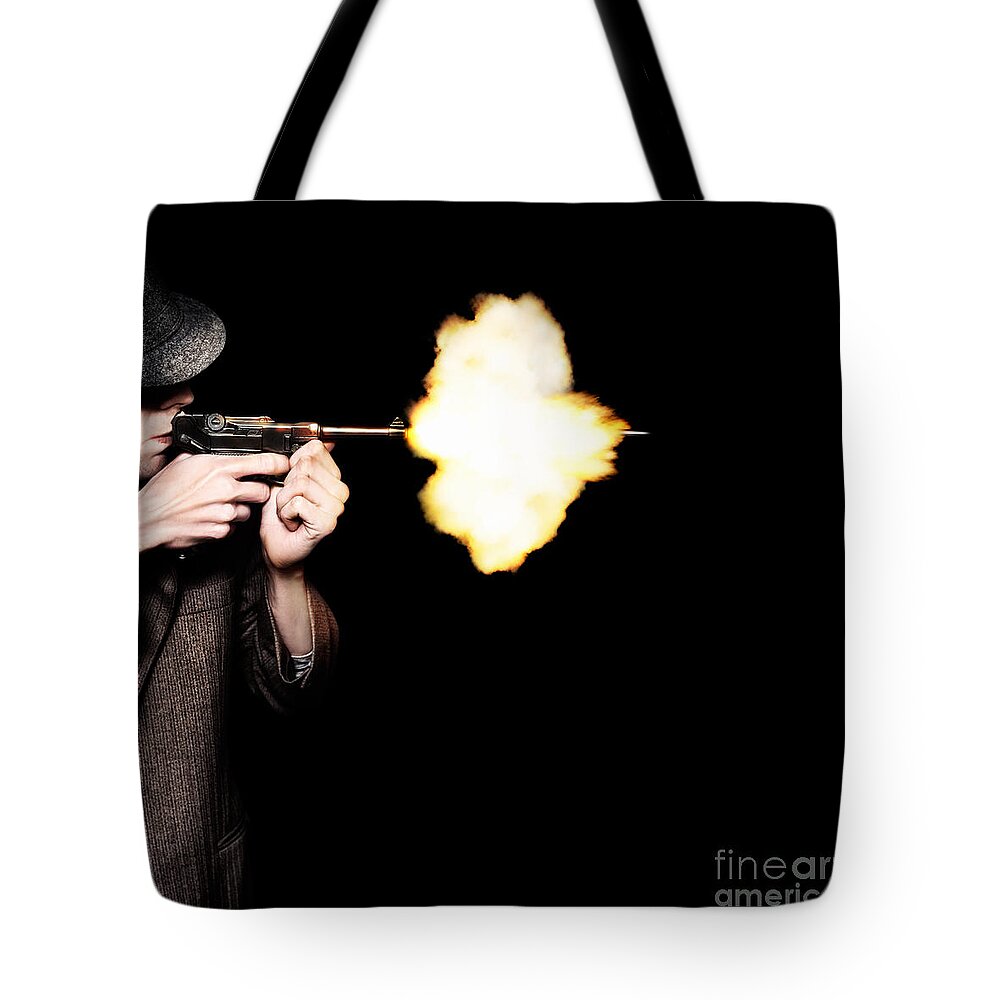 Gangster Tote Bag featuring the photograph Vintage Gangster Man Shooting Gun On Black by Jorgo Photography