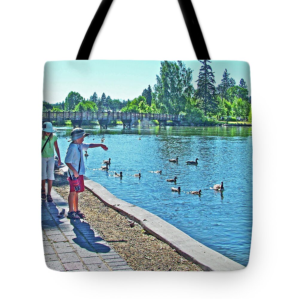 Walkway By The Des Chutes River In Bend Tote Bag featuring the photograph Walkway by the Des Chutes River in Bend, Oregon by Ruth Hager
