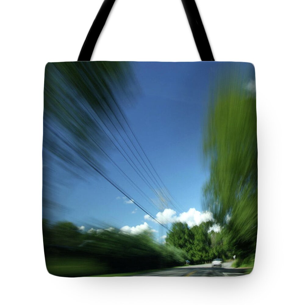 Action Tote Bag featuring the photograph Warp Speed by Karol Livote
