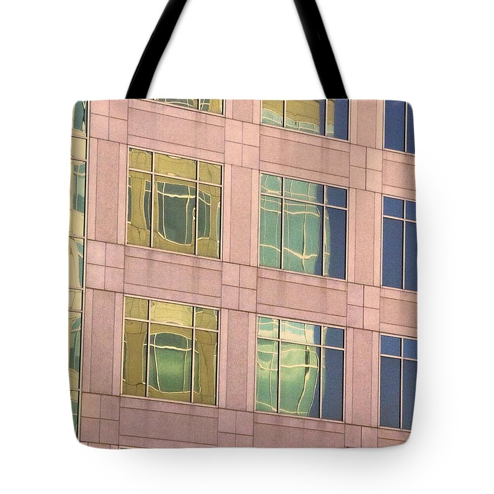 Architecture Tote Bag featuring the photograph Warped Window Reflectionss by Linda Phelps