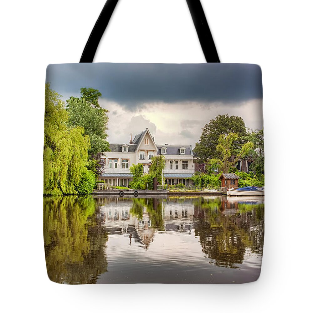 Netherlands Tote Bag featuring the photograph Water Reflections by Nadia Sanowar