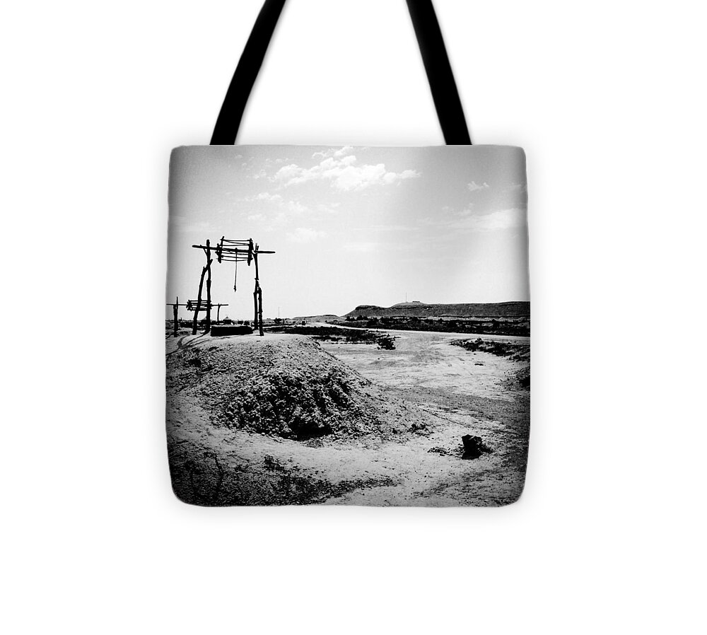 Blackandwhite Tote Bag featuring the photograph Water Well by Janan Yakula
