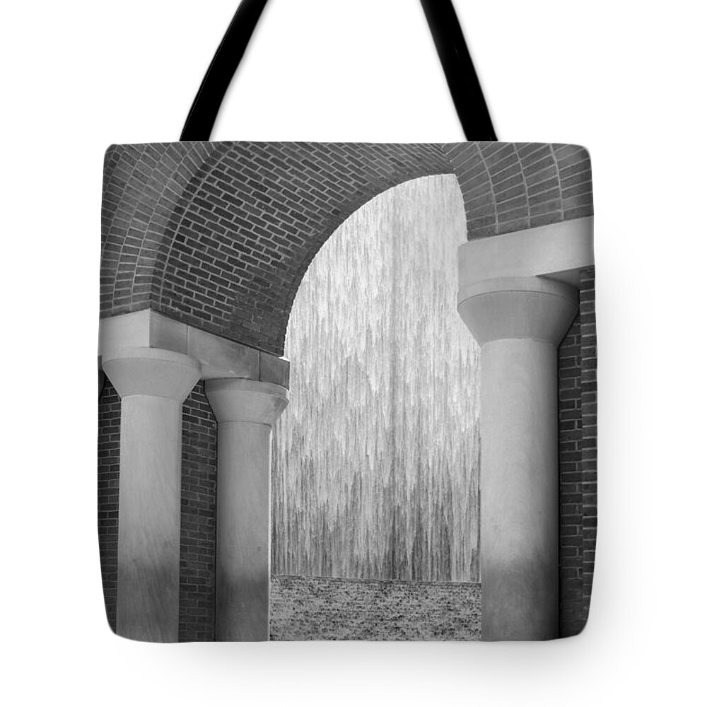 Houstonian Tote Bag featuring the photograph Waterwall and Arch 3 in Black and White by Angela Rath