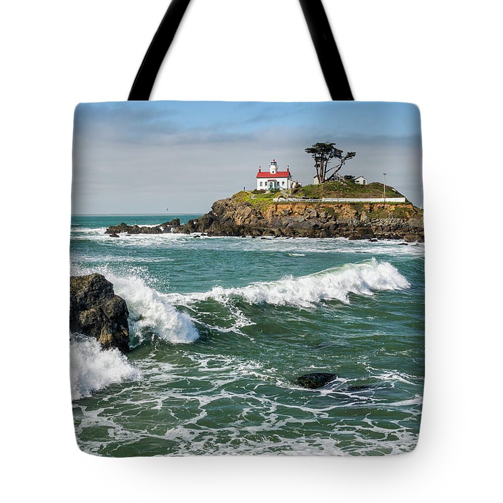 Crescent City Tote Bag featuring the photograph Wave Break and the Lighthouse by Greg Nyquist