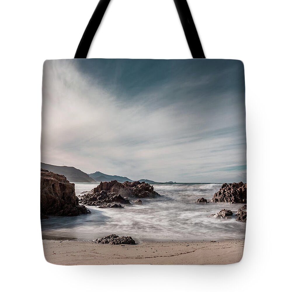 Sun setting over beach and calvi citadel in Corsica Tote Bag by Jon Ingall  - Pixels