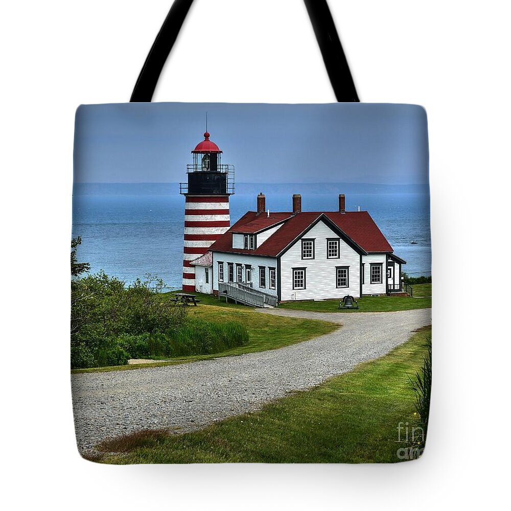 Wet Quoddy Head Lighthouse Tote Bag featuring the photograph West Quoddy Head Lighthouse by Steve Brown