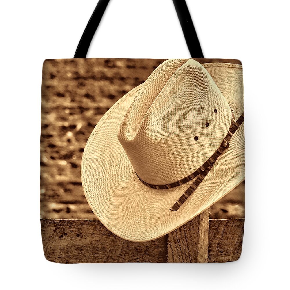 Western Tote Bag featuring the photograph White Cowboy Hat on Fence by American West Legend By Olivier Le Queinec