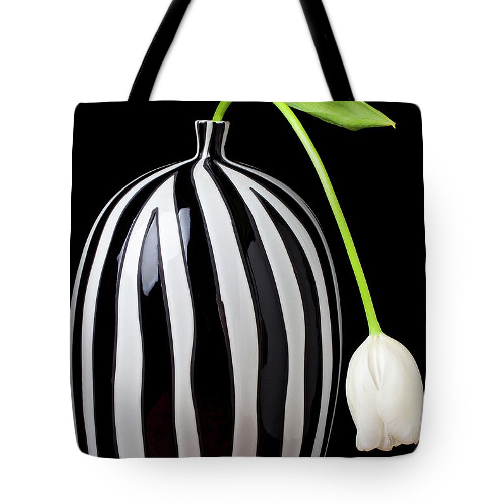 White Tote Bag featuring the photograph White tulip in striped vase by Garry Gay