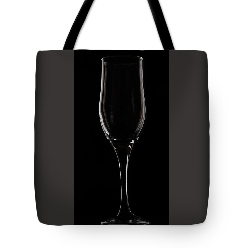 Wine Glass Tote Bag featuring the photograph Wine glass by Sergey Simanovsky