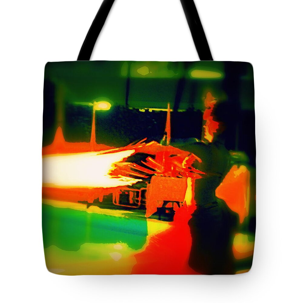Fire Tote Bag featuring the photograph Woman dancing with Fire by Elton Hazel