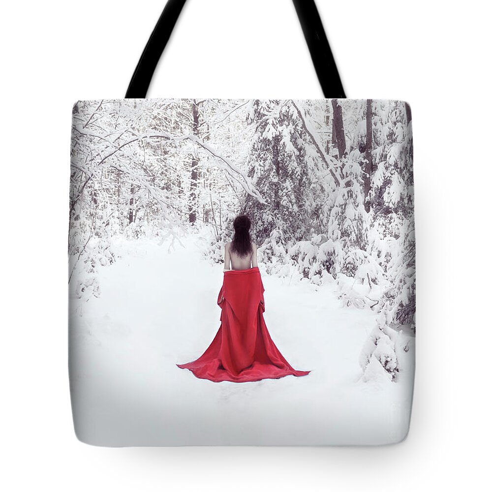 Woman in red kimono and bare shoulders walking away in snow Tote Bag