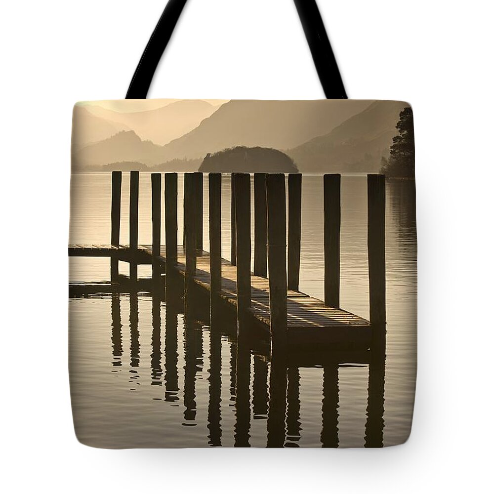 Calm Tote Bag featuring the photograph Wooden Dock In The Lake At Sunset by John Short