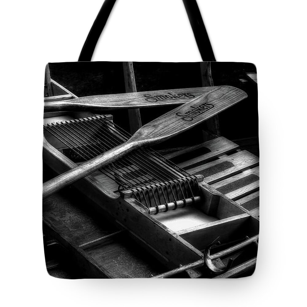 Wooden Rowboat Tote Bag featuring the photograph Wooden Rowboat And Oars In Black And White by Carol Montoya