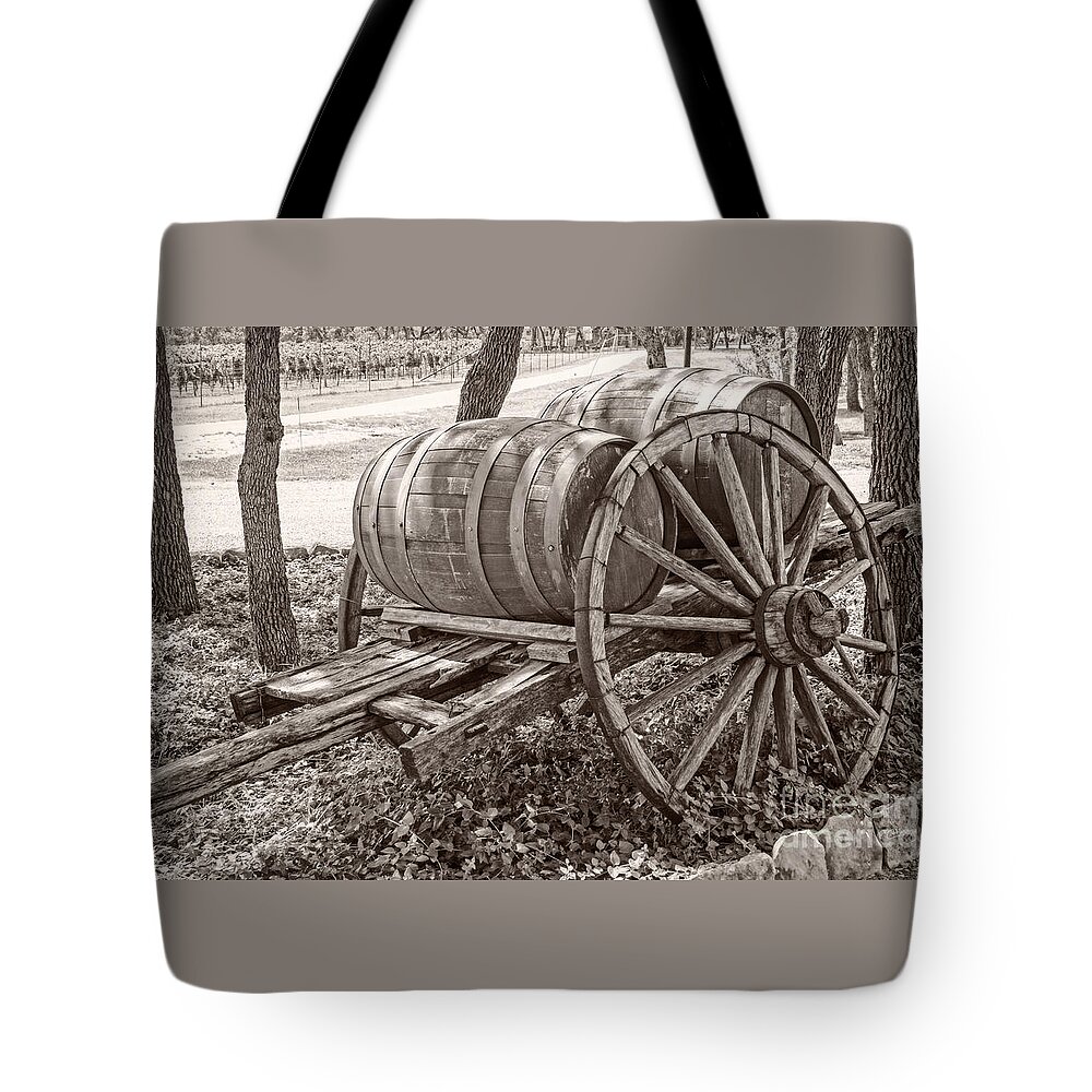 Wooden Wine Barrels Tote Bag featuring the photograph Wooden wine barrels on cart by Imagery by Charly