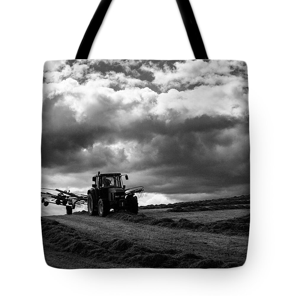 Aleckc Tote Bag featuring the photograph Working The Fields by Aleck Cartwright