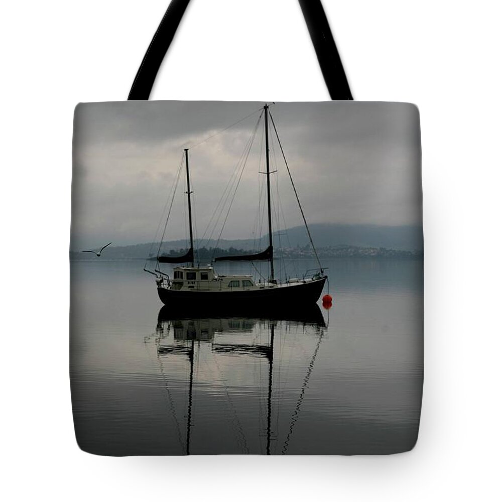 Seascapes Tote Bag featuring the photograph Yacht At Silent Moorings by Lee Stickels