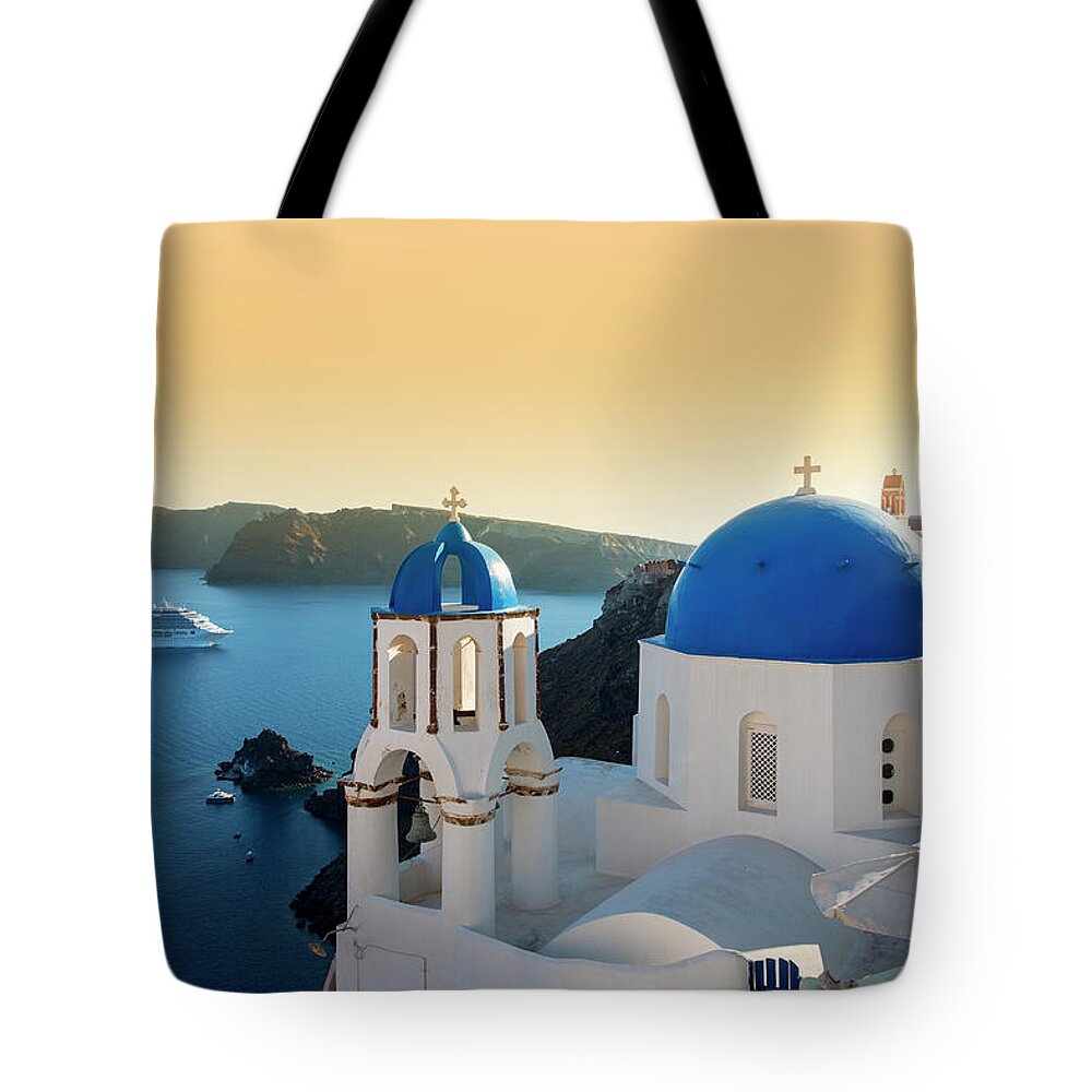 Greek Culture Tote Bag featuring the photograph Blue Domed Churches At Sunset, Oia #1 by Sylvain Sonnet