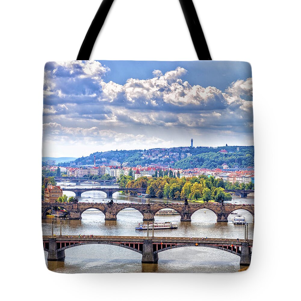 River Tote Bag featuring the photograph Bridge and rooftops of Prague #6 by Vivida Photo PC