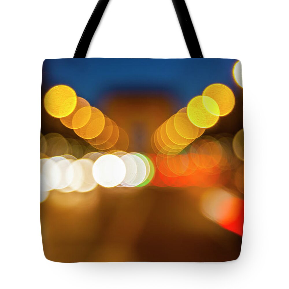 Outdoors Tote Bag featuring the photograph Defocused Lights #1 by Stuart Dee