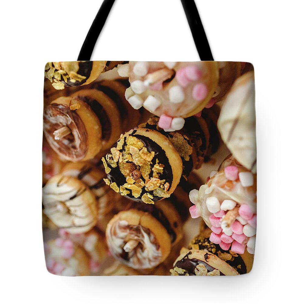 Addict Tote Bag featuring the photograph Donuts of different flavors, to put on an unhealthy diet #1 by Joaquin Corbalan