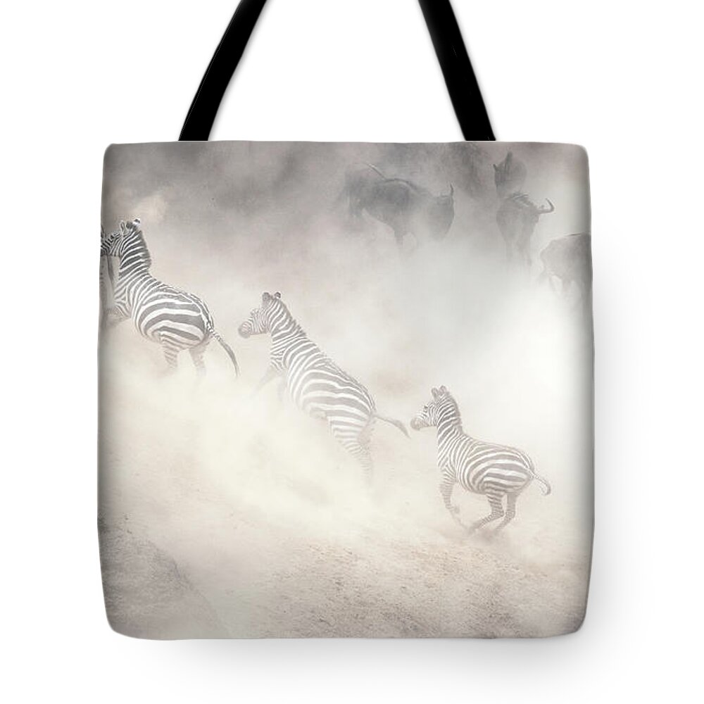 Wildlife Tote Bag featuring the photograph Dramatic Dusty Great Migration in Kenya by Good Focused