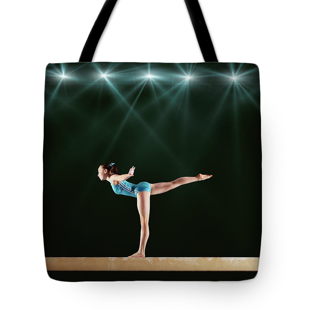 Focus Tote Bag featuring the photograph Gymnast Performing Routine On Balance #1 by Robert Decelis Ltd