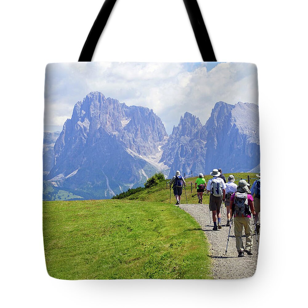 Italy Tote Bag featuring the photograph Hikers walking towards the Langkofel #1 by Steve Estvanik