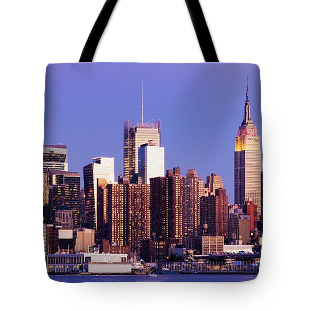 Water's Edge Tote Bag featuring the photograph Midtown Manhattan City Skyline At Night #1 by Deejpilot