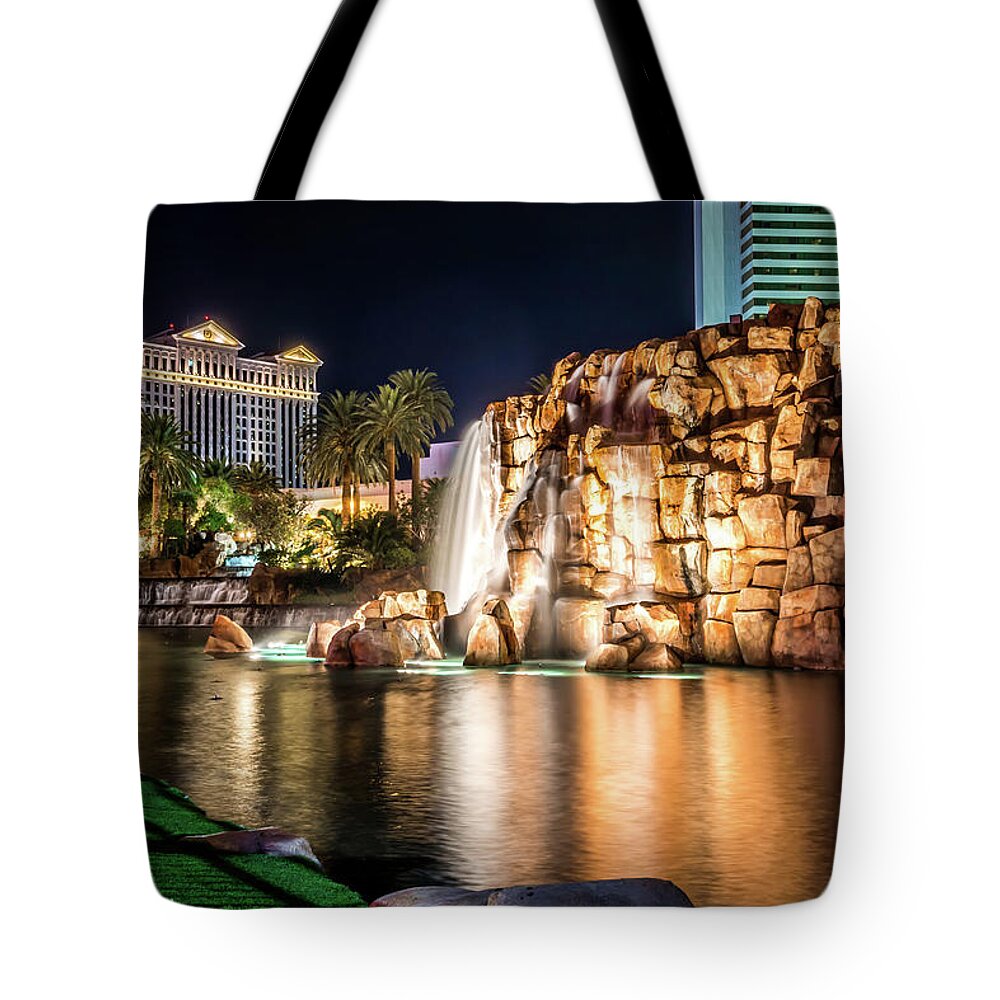 Vegas Tote Bag featuring the photograph Mirage Hotel Casino Volcano Fountain At Night #1 by Alex Grichenko