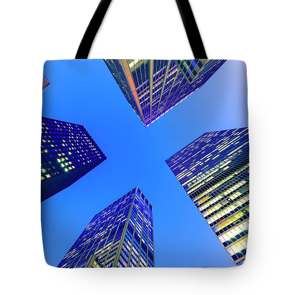 Majestic Tote Bag featuring the photograph Office Buildings At Night #1 by Fred Froese