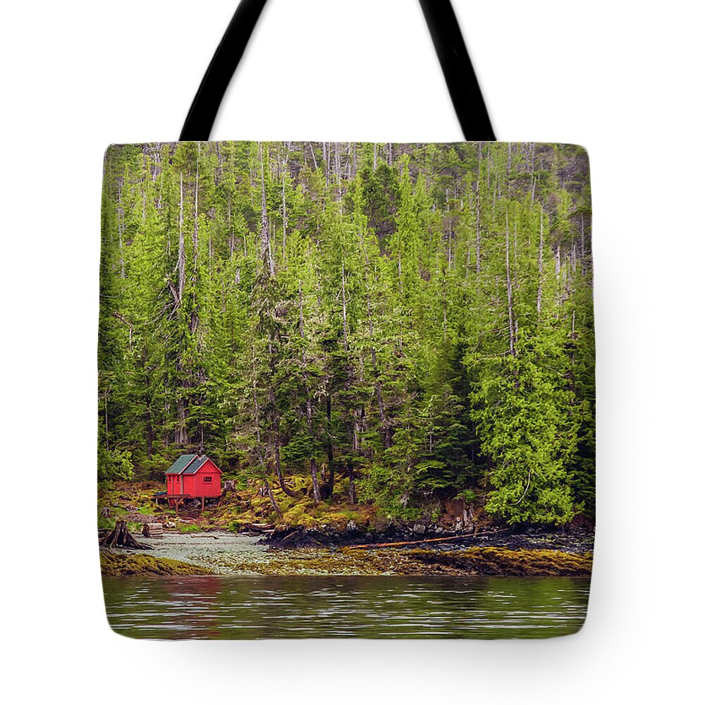 Alaska Tote Bag featuring the photograph Red Cabin on Edge of Alaskan Waterway in Evergreen Forest #1 by Darryl Brooks