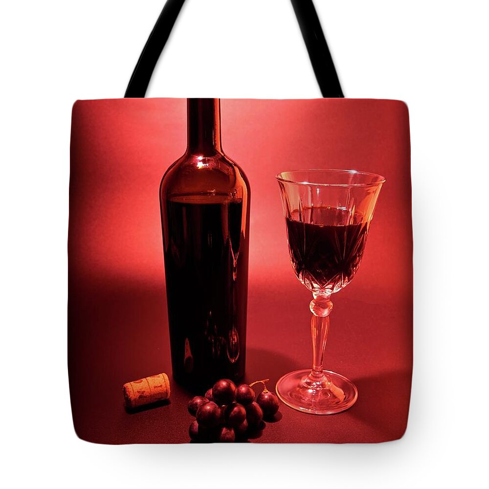 Red Tote Bag featuring the photograph Red wine display by Martin Smith