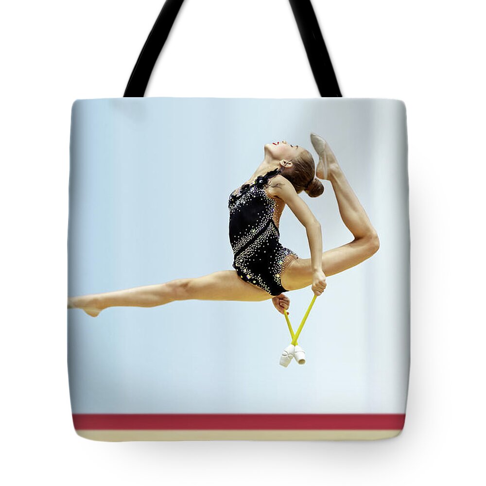 Acrobat Tote Bag featuring the photograph Rhythmic gymnastics competition by Anna Om