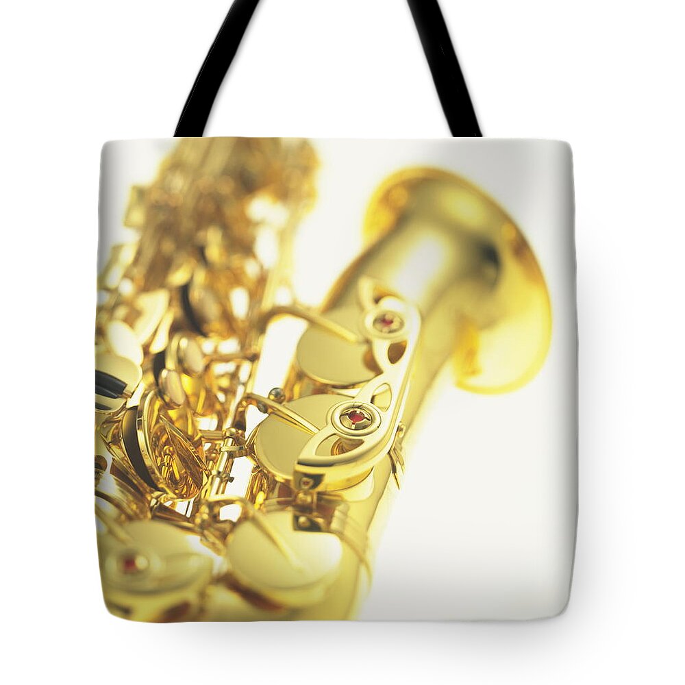 White Background Tote Bag featuring the photograph Saxophone #1 by F-64 Photo Office/amanaimagesrf