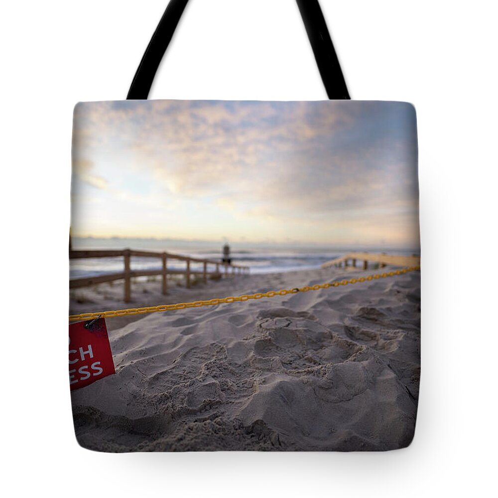 Beach Tote Bag featuring the photograph Sunrise after a storm on the beach. #1 by Kyle Lee