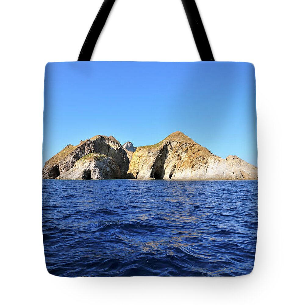 Tyrrhenian Sea Tote Bag featuring the photograph View Of The Palmarola Island #1 by Fabio Bianchini