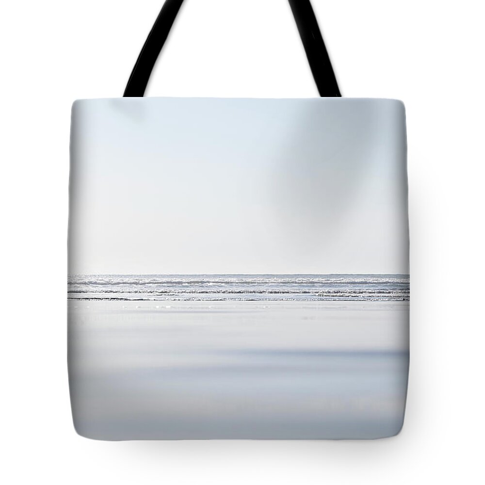 Tranquility Tote Bag featuring the photograph Waves Washing Into A Beach #1 by Steven Errico