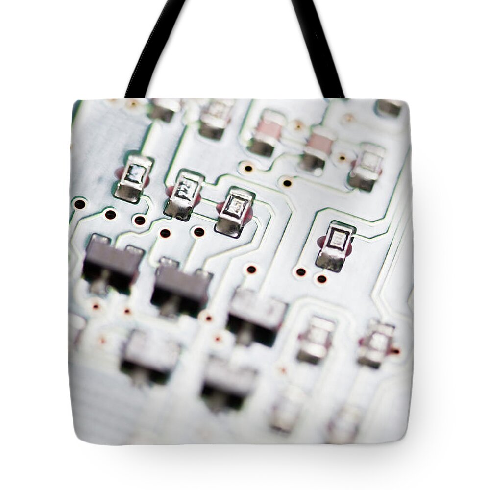 Transistor Tote Bag featuring the photograph Close-up Of A Circuit Board #17 by Nicholas Rigg