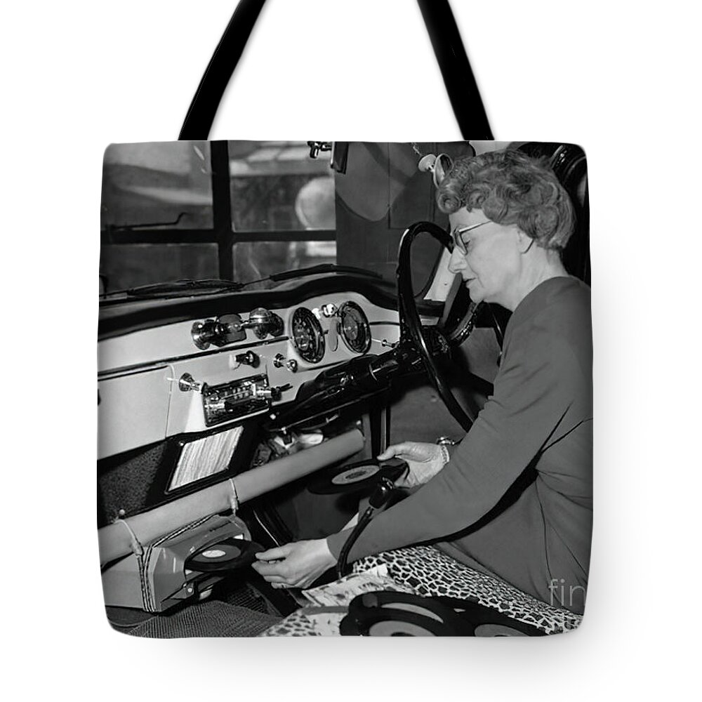 Vintage Tote Bag featuring the photograph 1950s Woman Demonstrating Vehicle Record Player by Retrographs