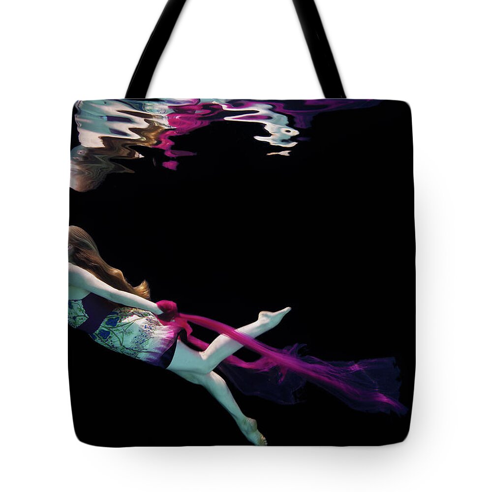 Underwater Tote Bag featuring the photograph Female Dancer Underwater Against Black #2 by Thomas Barwick