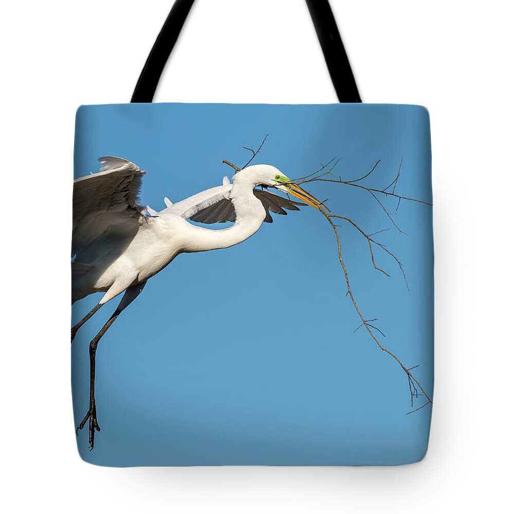 American Fauna Tote Bag featuring the photograph Great Egret With Stick #2 by Ivan Kuzmin