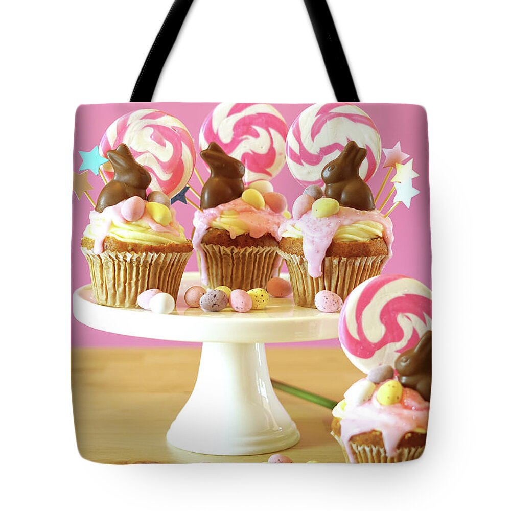 Easter Tote Bag featuring the photograph Easter theme candy land drip cupcakes in party table setting. #3 by Milleflore Images