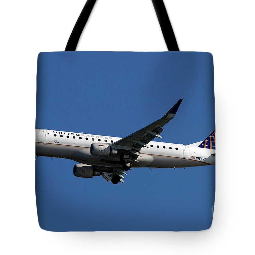 Airplane Tote Bag featuring the photograph on approach to San Francisco International Airport #34 by Jason O Watson