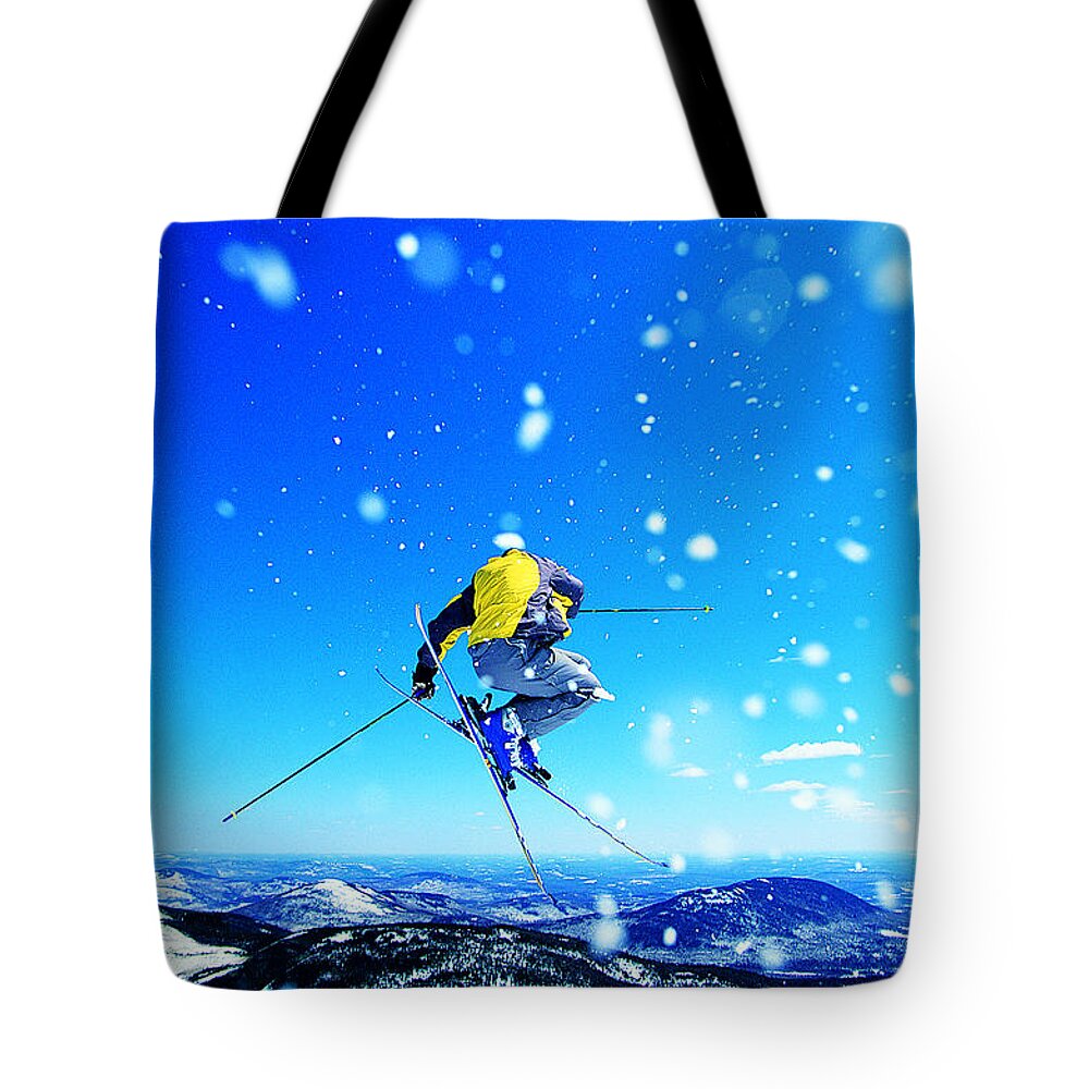 Skiing Tote Bag featuring the photograph Man Skiing #4 by Digital Vision.