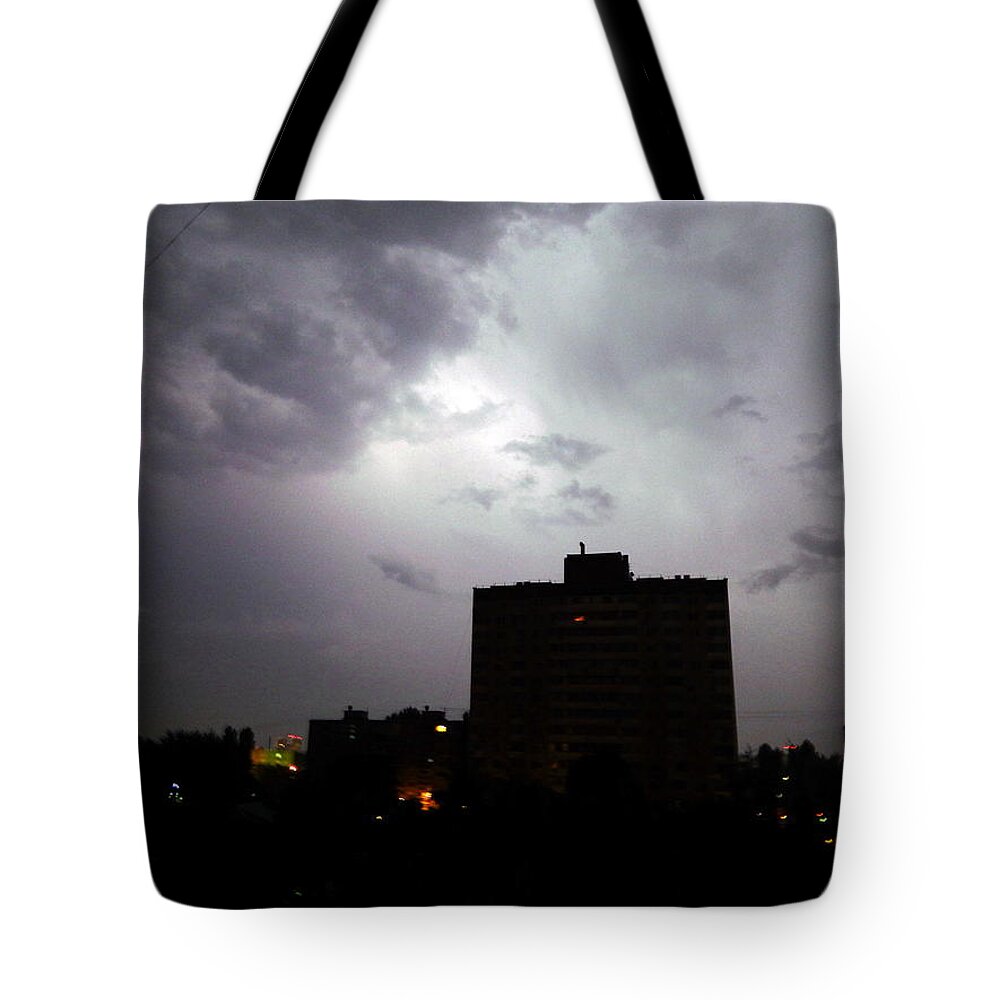 Storm Tote Bag featuring the photograph Lightning and thunder at night in the city it's raining #7 by Oleg Prokopenko