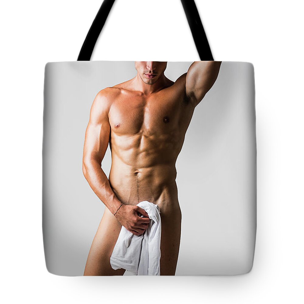 Naked muscular man covering crotch with shirt Throw Pillow
