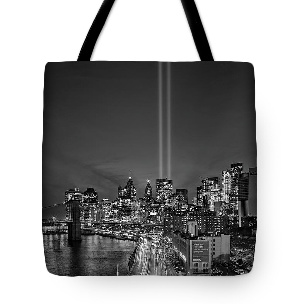 911 Memorial Tote Bag featuring the photograph 911 Tribute In Light In NYC BW by Susan Candelario